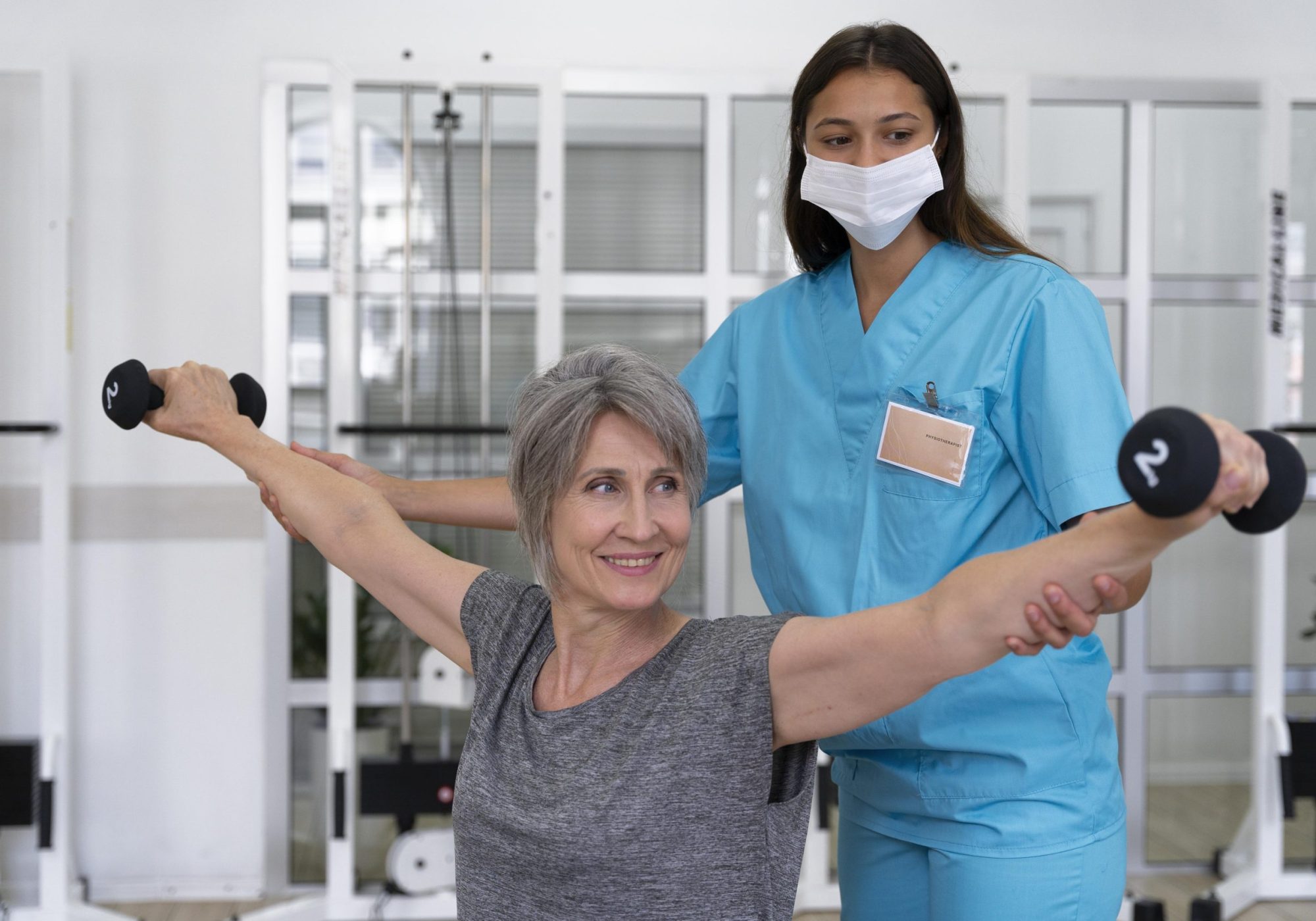 medical-assistant-helping-patient-with-physiotherapy-exercises
